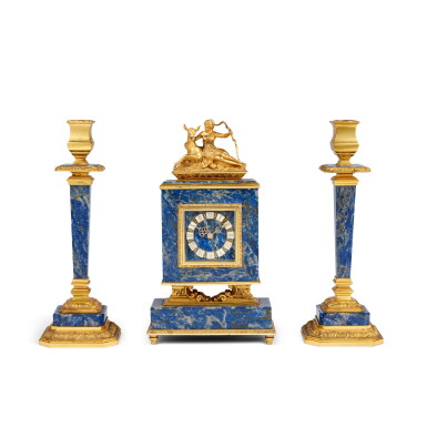 View full screen - View 1 of Lot 1024. An Italian silver-gilt mounted lapis lazuli candlestick and clock garniture, Politi, Milan, mid-20th century.