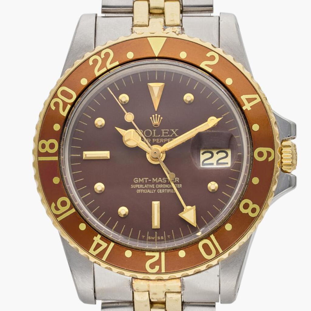 View full screen - View 1 of Lot 340. Reference 1675 GMT-Master 'Root Beer' | A yellow gold and stainless steel automatic dual time wristwatch with date, bracelet, and nipple dial, Circa 1978.