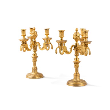 View full screen - View 1 of Lot 124. A pair of Louis XVI gilt-bronze three-light candelabra, circa 1780 | Paire de candélabres à trois lumières en bronze doré d'époque Louis XVI, vers 1780.