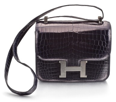 View full screen - View 1 of Lot 1258. HERMÈS | BLEU MARINE NILOTICUS CROCODILE LEATHER CONSTANCE 24 WITH SILVER HARDWARE | 愛馬仕 | 深藍色鱷魚皮24公分CONSTANCE包附銀色金屬配件.