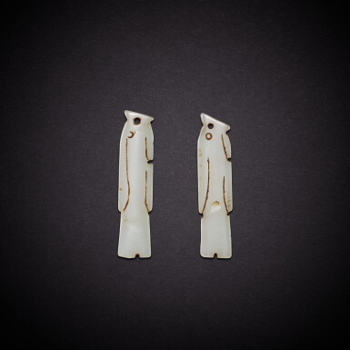 View full screen - View 1 of Lot 6830. A rare pair of white glass 'fish' pendant, Western Zhou dynasty | 西周 琉璃魚墜飾一對.