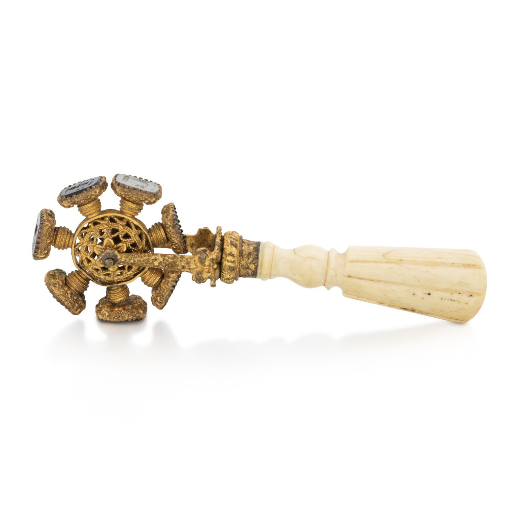 View full screen - View 1 of Lot 1139. A walrus ivory and gilt-metal seal wheel, circa 1820.