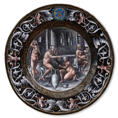 View full screen - View 1 of Lot 117. A Limoges grisaille painted circular enamel plate depicting Psyche at her Bath, Attributed to Pierre Reymond (1513-1584), circa 1570-1580.