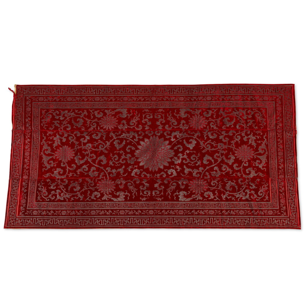 View full screen - View 1 of Lot 238. A large red-ground cut velvet and metallic thread 'lotus' kang cover, Qing dynasty, 18th / 19th century | 清十八 / 十九世紀 紅地纏枝蓮紋漳絨炕毯.