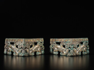 View full screen - View 1 of Lot 627. A pair of rare gold and silver-inlaid bronze corner fittings, Eastern Zhou dynasty, Warring States period | 東周 戰國 銅錯金銀獸形承足一對.