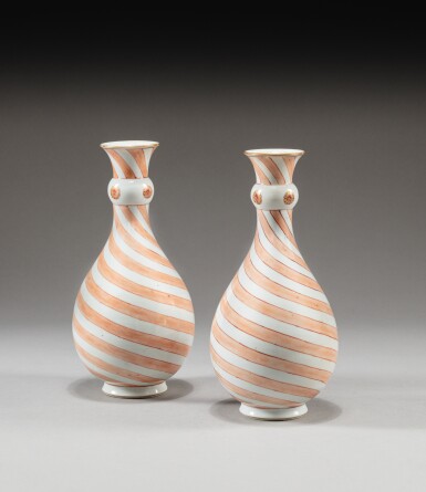 View full screen - View 1 of Lot 19. a Pair of famille-rose 'swirl' vases, Qing dynasty, 18th century | 清十八世紀 矾红彩旋纹瓶一對 .