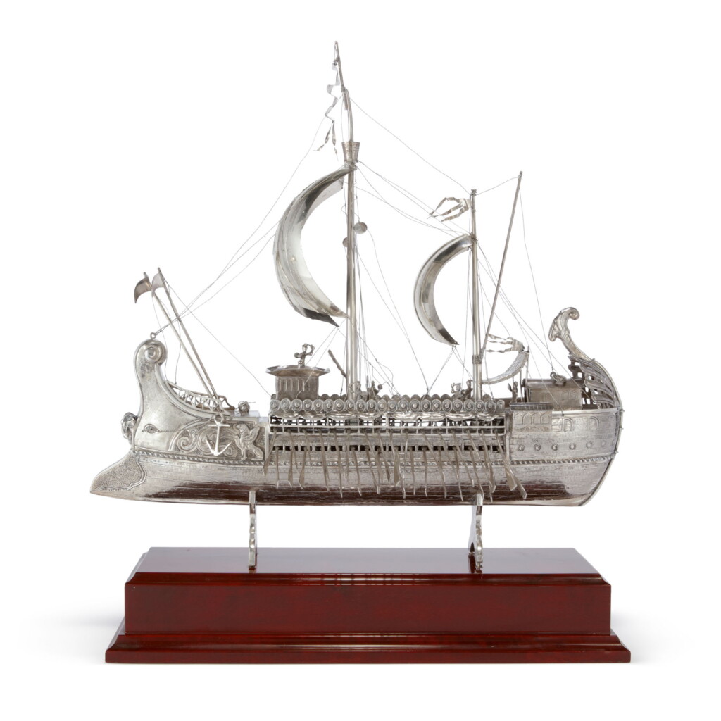 View full screen - View 1 of Lot 873. A SPANISH SILVER MODEL OF AN ANCIENT GREEK BIREME, MID 20TH CENTURY.