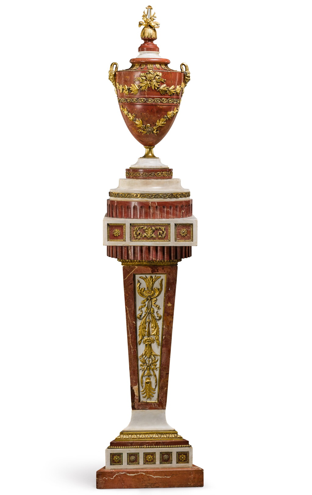 View full screen - View 1 of Lot 23. A Spanish gilt-bronze mounted rojo alicante and white marble vase on pedestal, late 18th century, attributed to the Fabrica del Buen Retiro.