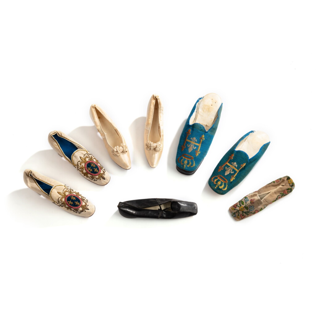 View full screen - View 1 of Lot 600. A group of eight silk, taffetas, embroyed and leather shoes, 19th century | Ensemble de huit chaussures en soie, taffetas, broderie et cuir, XIXe siècle.