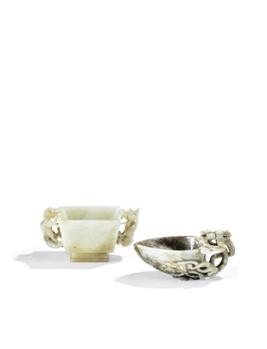 View full screen - View 1 of Lot 61. DEUX COUPES LIBATOIRES EN JADE DYNASTIE QING, XVIIIE SIÈCLE| 清十八世紀 灰玉龍耳桃式盃 及 青白玉仿古紋雙龍耳方盃 | Two jade libation cups, Qing Dynasty, 18th century.
