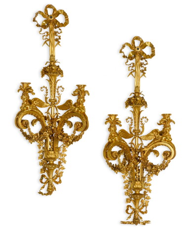 View full screen - View 1 of Lot 55. A pair of Louis XVI style gilt-bronze two-light wall-appliques, Paris, third quarter 19th century, after a design by Jean-François Forty.