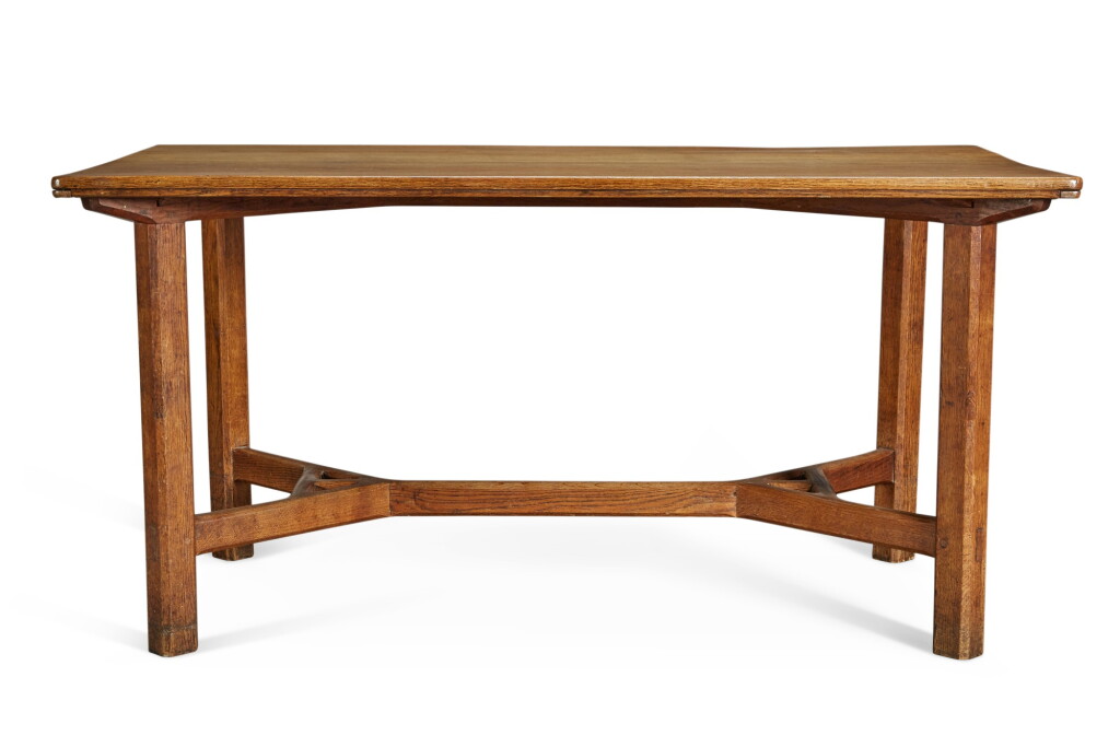 View full screen - View 1 of Lot 154. A COTSWOLD SCHOOL 'HAYRAKE' OAK DINING TABLE, CIRCA 1930, AFTER A DESIGN BY GORDON RUSSELL.