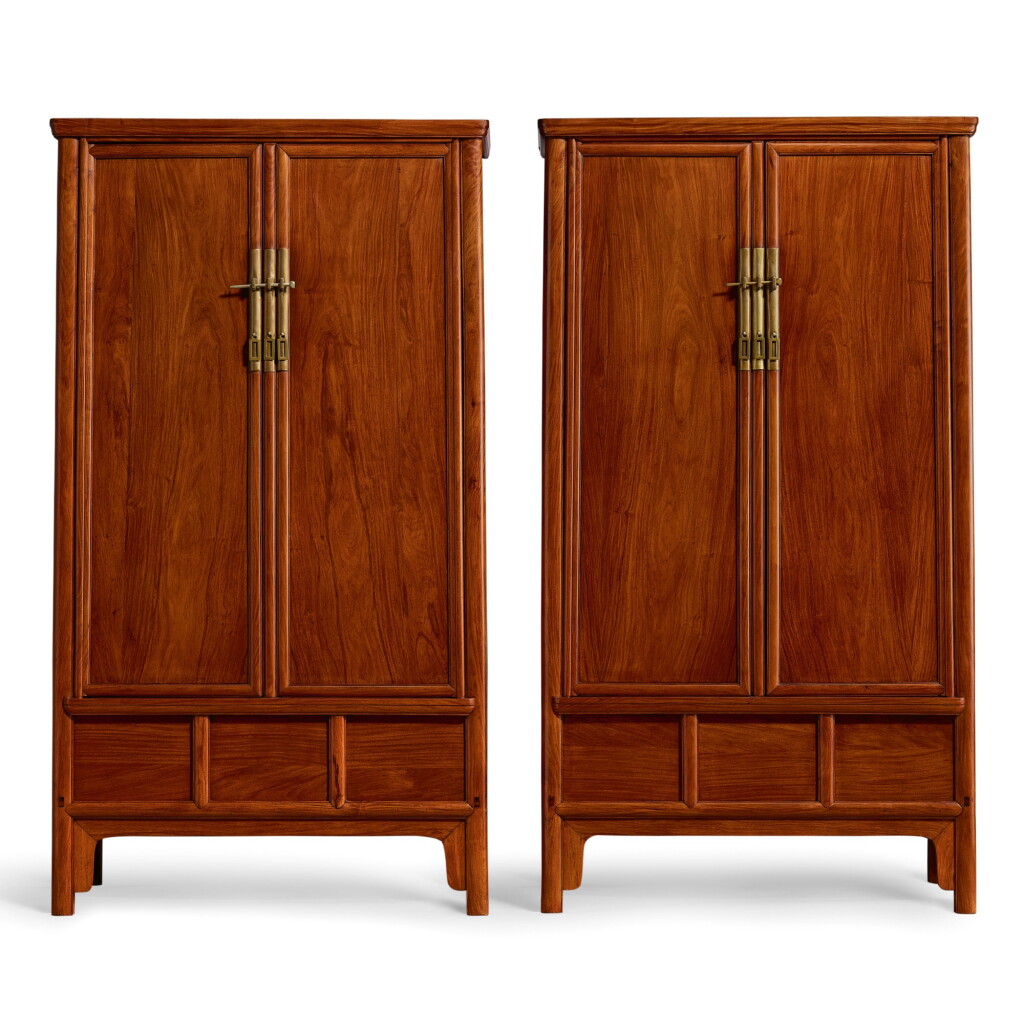View full screen - View 1 of Lot 45. A PAIR OF HUANGHUALI ROUND-CORNER TAPERED CABINETS, YUANJIAOGUI MING DYNASTY, 17TH CENTURY | 明十七世紀 黃花梨有櫃膛圓角櫃成對.