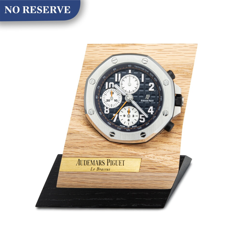 View full screen - View 1 of Lot 219. AUDEMARS PIGUET | ROYAL OAK OFFSHORE A STAINLESS STEEL ALARM DESK CLOCK WITH WOODEN STAND, CIRCA 2017.
