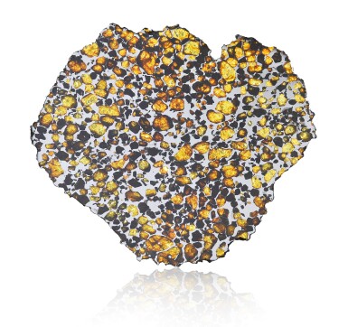 View full screen - View 1 of Lot 102. FROM THE HIGHEST DESERT ON EARTH — A SELECT COMPLETE SLICE OF AN IMILAC PALLASITE WITH EXTRATERRESTRIAL GEMSTONES.