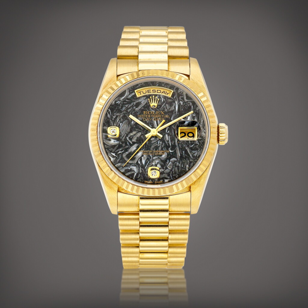 View full screen - View 1 of Lot 2234. Day-Date, Reference 18238 | A yellow gold and diamond-set wristwatch with day, date, ammonite dial and bracelet, Circa 1999 | 勞力士 | Day-Date 型號18238 | 黃金鑲鑽石鏈帶腕錶,備日期、星期顯示及菊石錶盤,約1999年製.