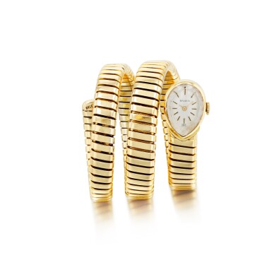 View full screen - View 1 of Lot 793. Bulgari | Montre de dame or, "Serpenti" | Lady's gold bracelet watch, 'Serpenti'.