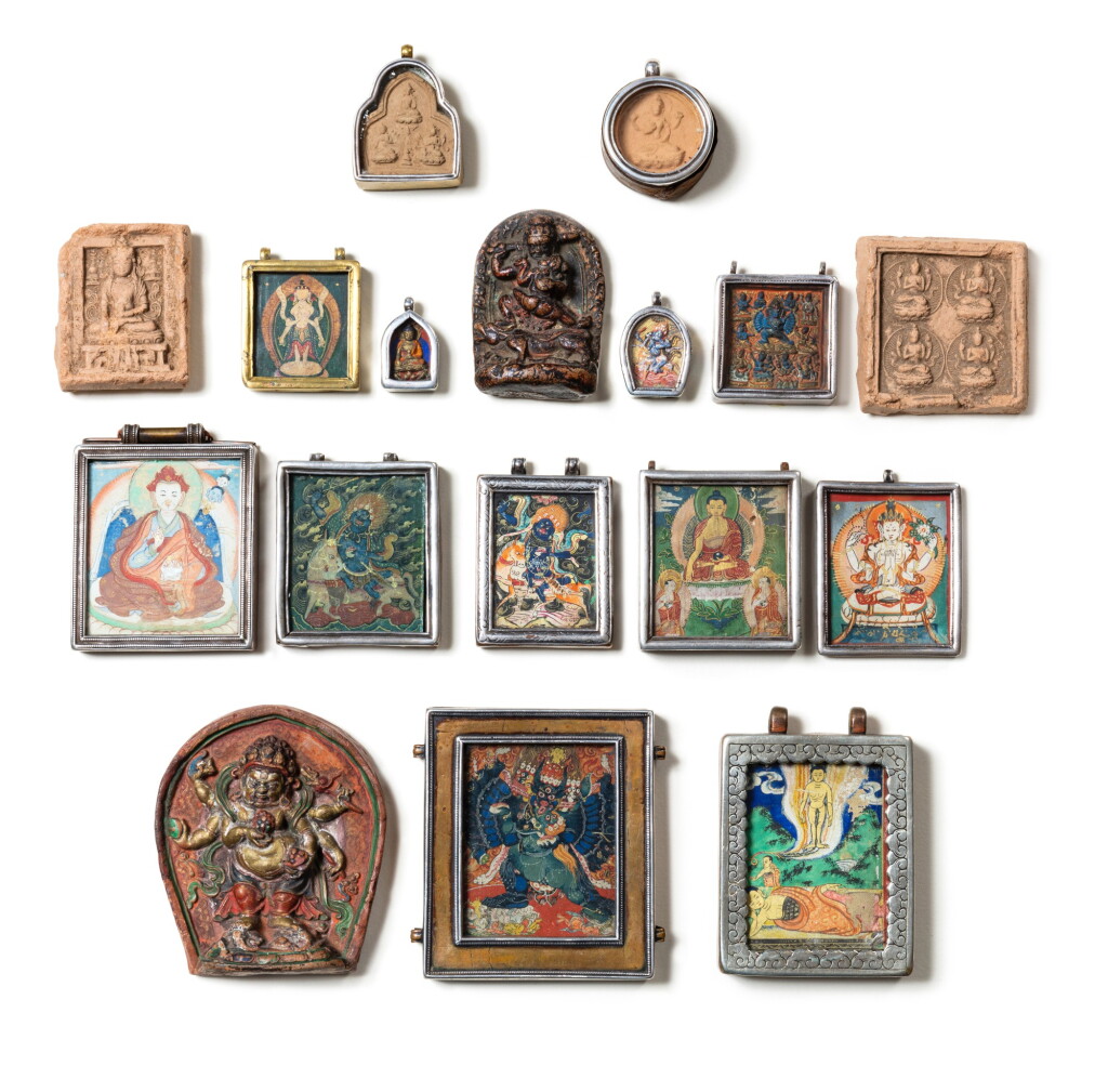 View full screen - View 1 of Lot 75. A study collection of seventeen small buddhist reliquaries and tsa tsa plaques Tibet, 19th- 20th century | 西藏 十九至二十世紀 佛牌及擦擦一組十七件.