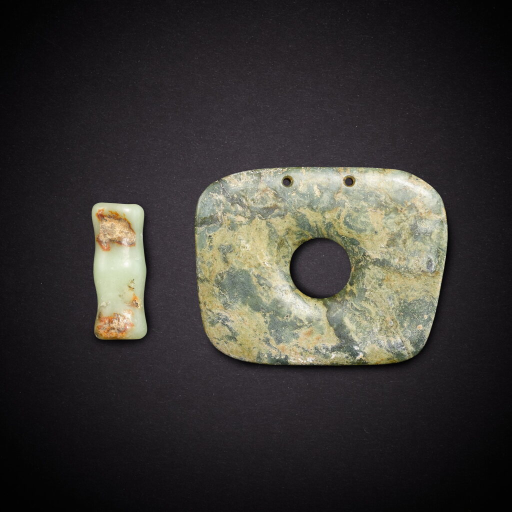 View full screen - View 1 of Lot 6810. A celadon jade tubular bead and a jade disc, bi, Neolithic period, Hongshan culture | 新石器時代 紅山文化 青玉管及方形璧.