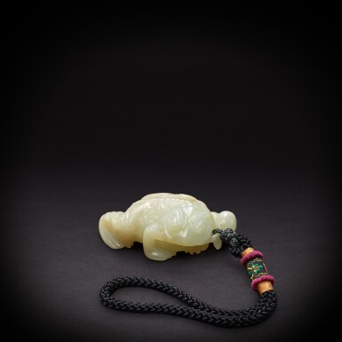 View full screen - View 1 of Lot 6878. A pale celadon jade figure of a toad, Qing dynasty, 18th - 19th century | 清十八至十九世紀 青白玉雕丁財兩旺把件.