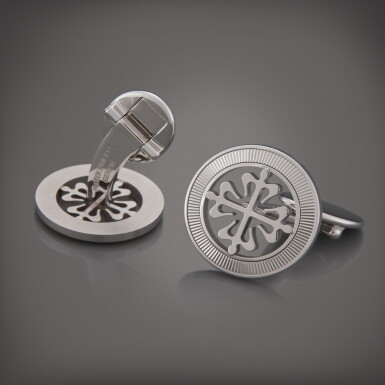 View full screen - View 1 of Lot 18. Calatrava Cross | A pair of white gold cufflinks with guilloched outer ring.