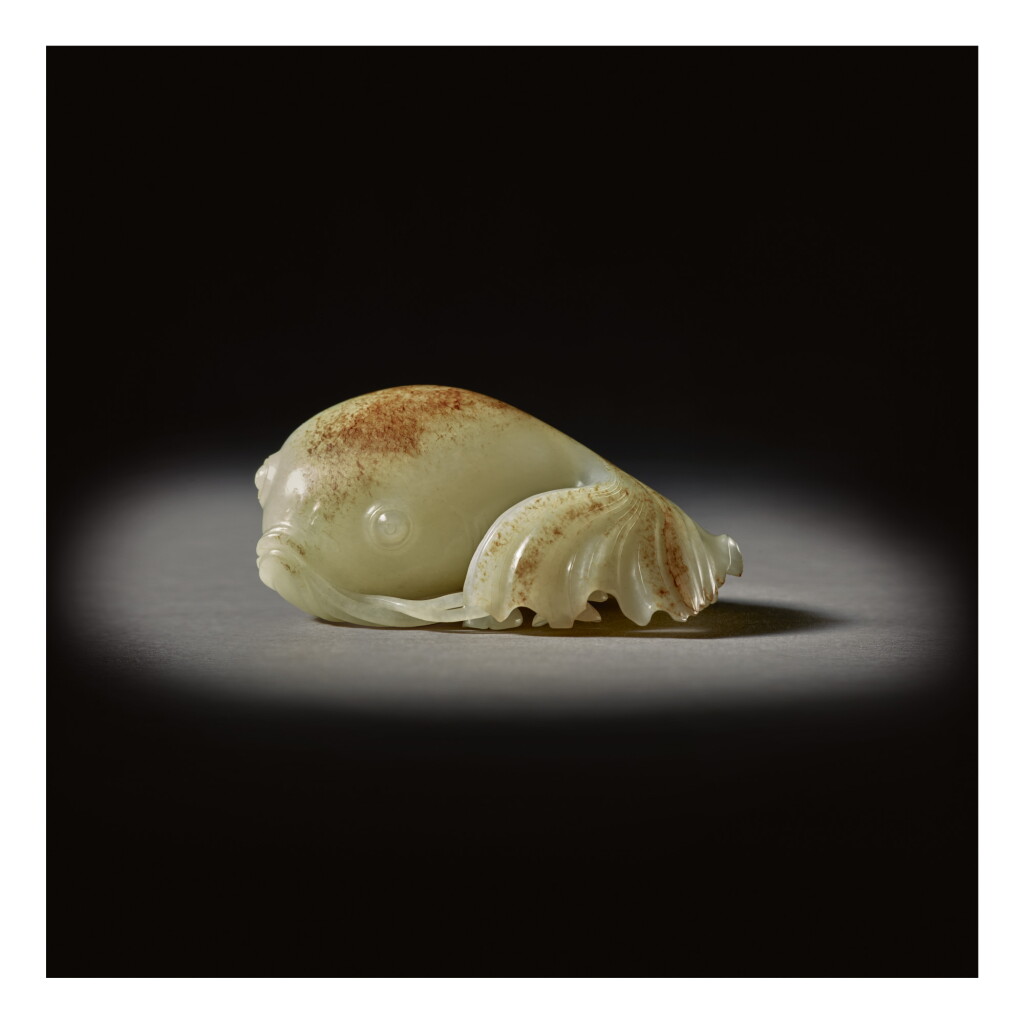 View full screen - View 1 of Lot 206. A SUPERB WHITE AND RUSSET JADE CARVING OF A GOLDFISH, QING DYNASTY, QIANLONG PERIOD.