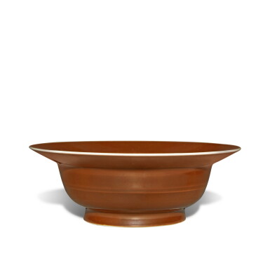 View full screen - View 1 of Lot 528. A brown-glazed bowl, Seal mark and period of Qianlong | 清乾隆 紫金釉弦紋折沿盌 《大清乾隆年製》款.