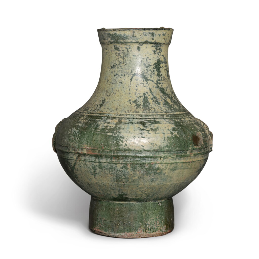 View full screen - View 1 of Lot 642. A green-glazed vessel (Hu), Han dynasty | 漢 綠釉壺.