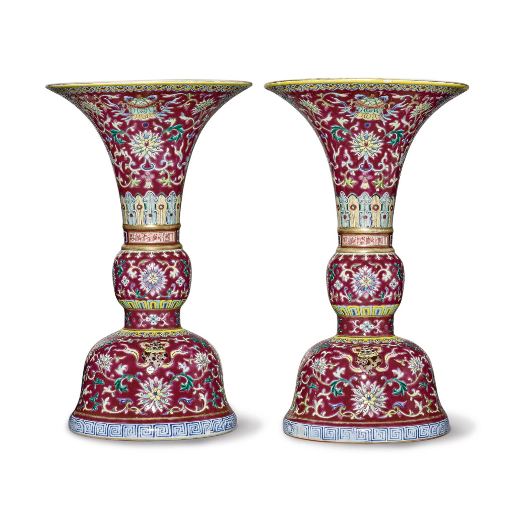 Voir en plein écran - Voir 1 du lot 539. A PAIR OF RUBY-GROUND FAMILLE-ROSE 'BAJIXIANG' ALTAR VASES (GU), QIANLONG SEAL MARKS AND PERIOD .
