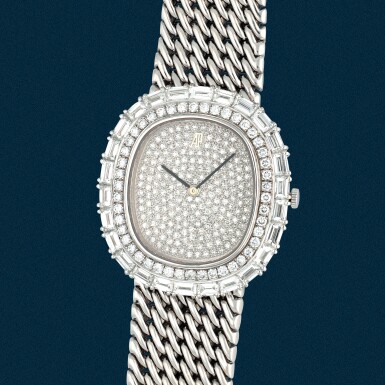 View full screen - View 1 of Lot 17. A white gold and diamond-paved bracelet watch | Circa 1995.