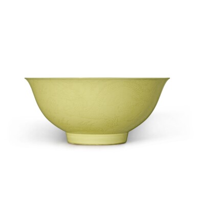 View full screen - View 1 of Lot 76. An incised yellow-enameled 'dragon' bowl, Mark and period of Yongzheng | 清雍正 黃釉暗刻趕珠雲龍紋盌 《大清雍正年製》款.