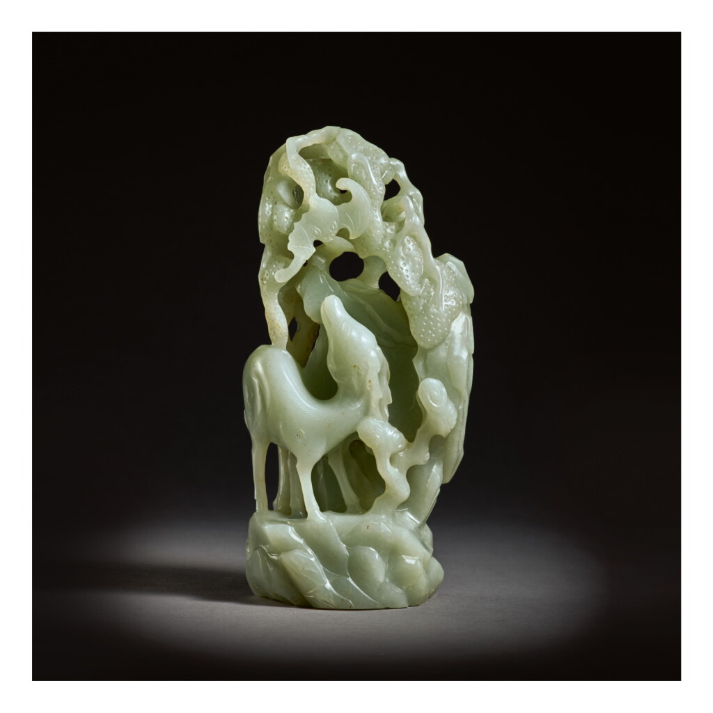 View full screen - View 1 of Lot 240. AN UNUSUAL PALE GREEN JADE 'DEER AND BAT' GROUP, QING DYNASTY, EARLY 18TH CENTURY.