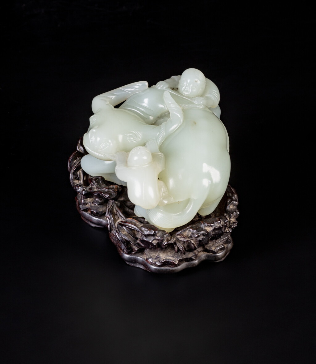 View full screen - View 1 of Lot 58. A pale celadon jade 'buffalo and boys' carving, Qing dynasty, Qianlong period | 清乾隆 青白玉童子牧牛擺件.