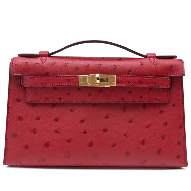 View full screen - View 1 of Lot 90. Rouge Vif Ostrich Kelly Pochette Gold Hardware, 2017.