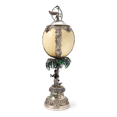 View full screen - View 1 of Lot 277. A GERMAN SILVER, ENAMEL, AND GEM-SET OSTRICH EGG CUP AND COVER, PROBABLY HANAU, CIRCA 1890.