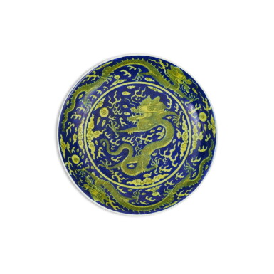 View full screen - View 1 of Lot 121. A blue-ground yellow-enameled 'dragon' dish, Seal mark and period of Jiaqing | 清嘉慶 青花地黃彩雲龍紋盤 《大清嘉慶年製》款 .