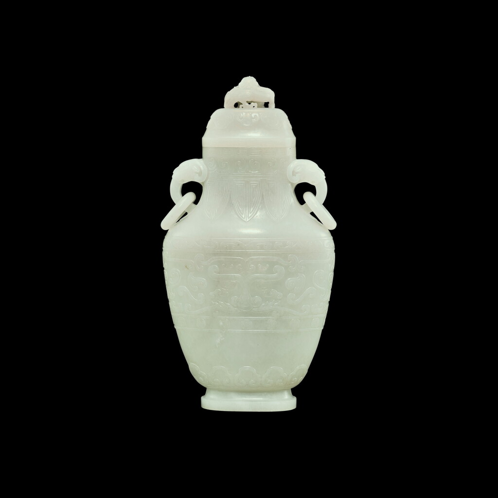 View full screen - View 1 of Lot 195. A white jade archaistic 'taotie' vase and cover, Qing dynasty, Qianlong period | 清乾隆 白玉仿古饕餮紋活環蓋瓶.