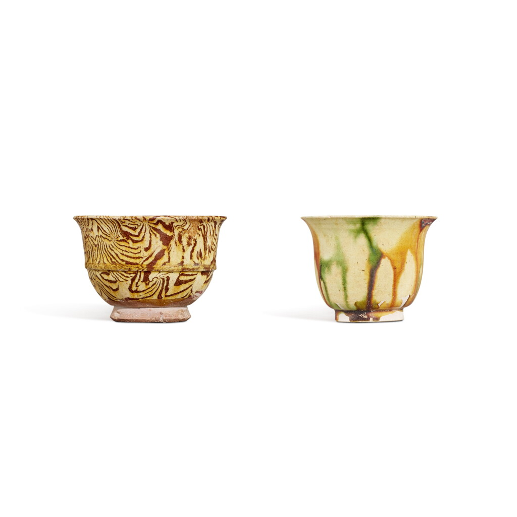 View full screen - View 1 of Lot 9524. A sancai-glazed cup and a yellow-glazed marbled cup, Tang dynasty | 唐 三彩撇口盃及黃釉絞胎弦紋盃.
