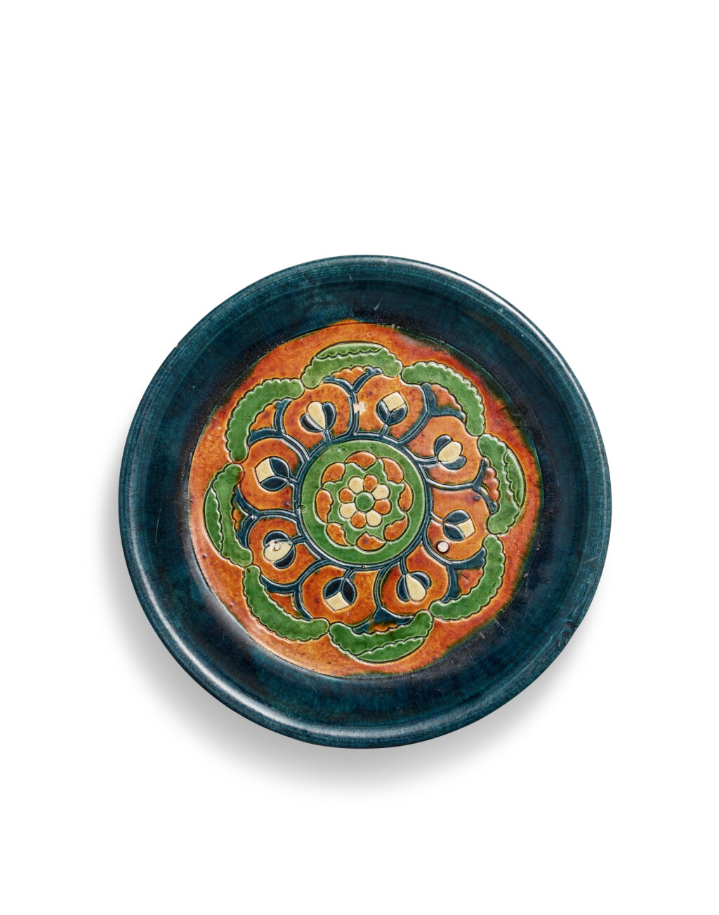 View full screen - View 1 of Lot 5119. A blue and sancai-glazed tripod dish, Tang dynasty | 唐 三彩加藍寶相花紋三足盤.