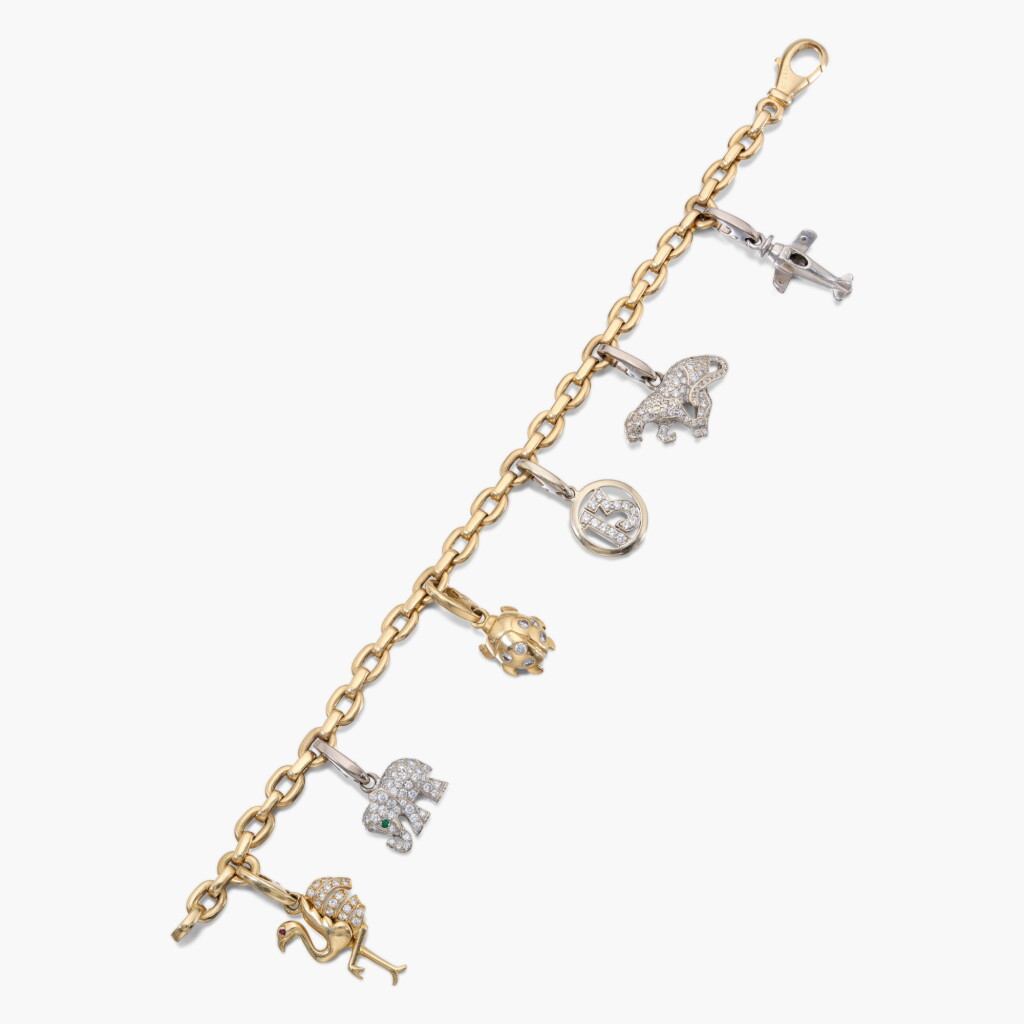 View full screen - View 1 of Lot 959. Gold and Diamond Charm Bracelet.