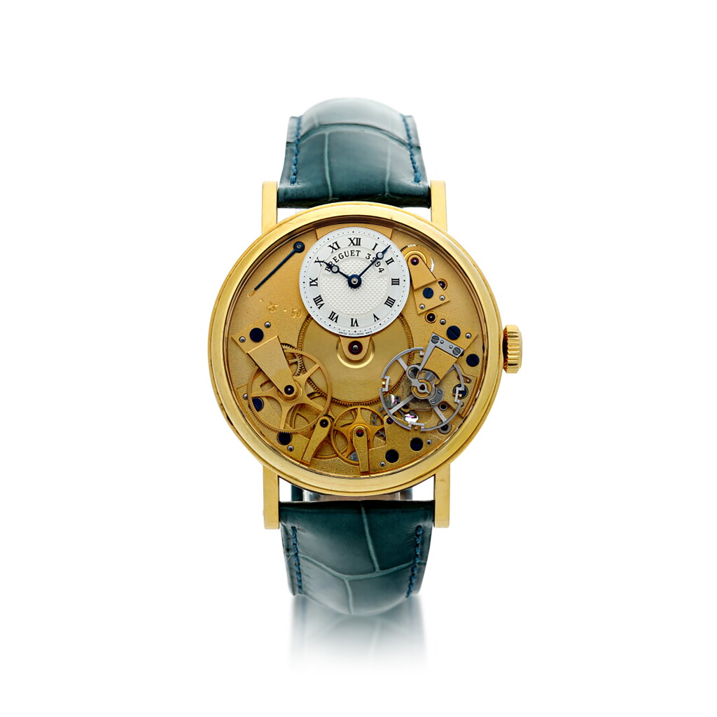 View full screen - View 1 of Lot 88. REFERENCE 7027 LA TRADITION A YELLOW GOLD SEMI-SKELETONIZED WRISTWATCH WITH POWER RESERVE INDICATION, CIRCA 2005.