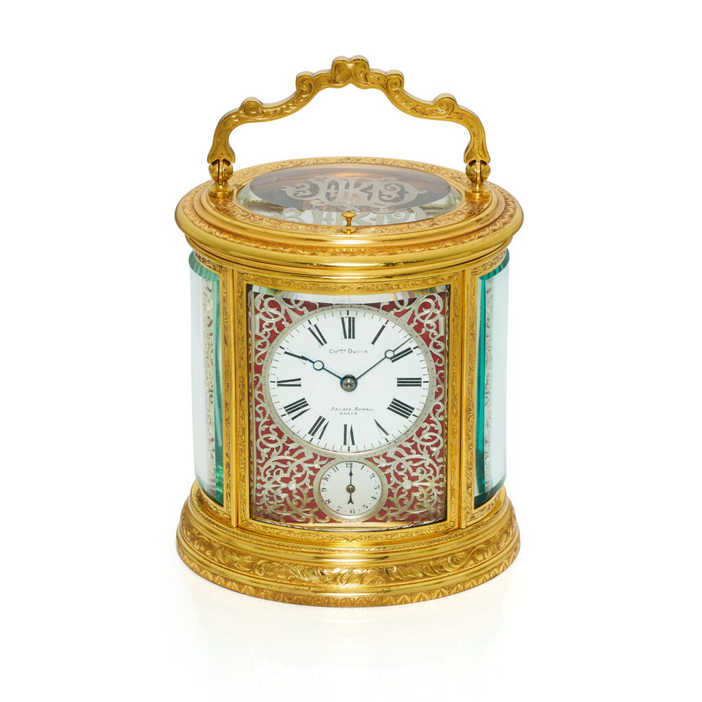 View full screen - View 1 of Lot 181. An engraved gilt-brass oval grande sonnerie repeating alarm carriage clock, Circa 1880.