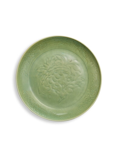 View full screen - View 1 of Lot 27. A large carved 'Longquan' celadon-glazed 'chrysanthemum' charger, Ming dynasty.