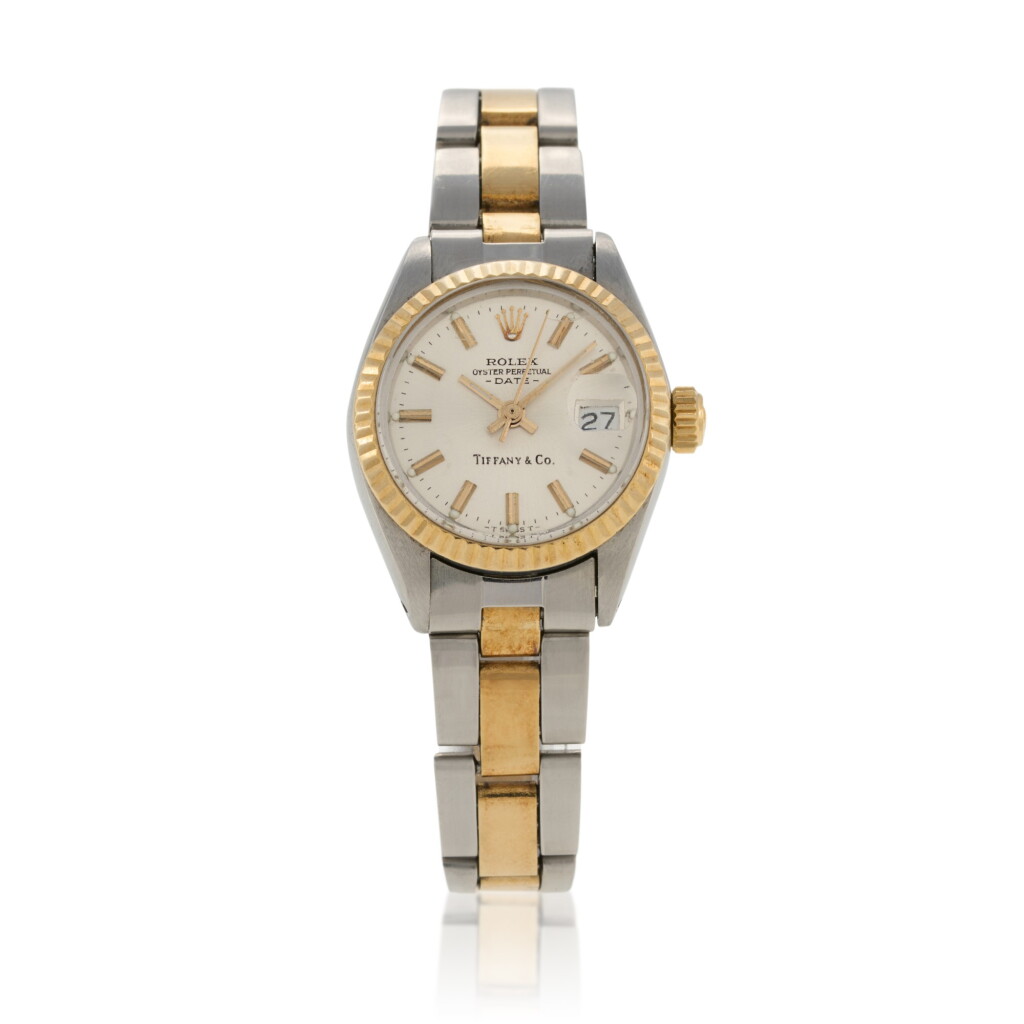 View full screen - View 1 of Lot 179. Retailed by Tiffany & Co. Oyster Perpetual Date, Ref. 6917 Stainless steel and yellow gold wristwatch with date and bracelet Circa 1979.