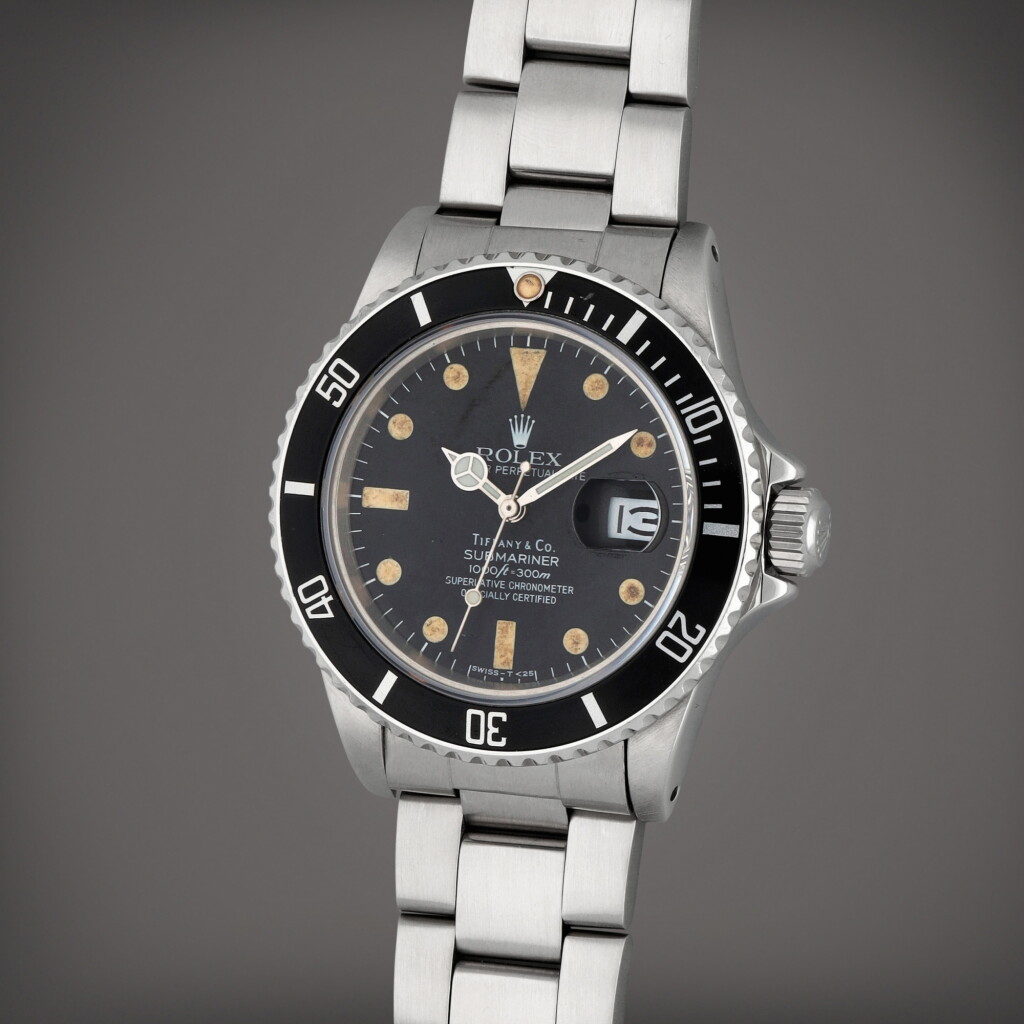 View full screen - View 1 of Lot 294. Retailed by Tiffany & Co: Submariner, Reference 16800 | A stainless steel wristwatch with date and bracelet | Circa 1984.