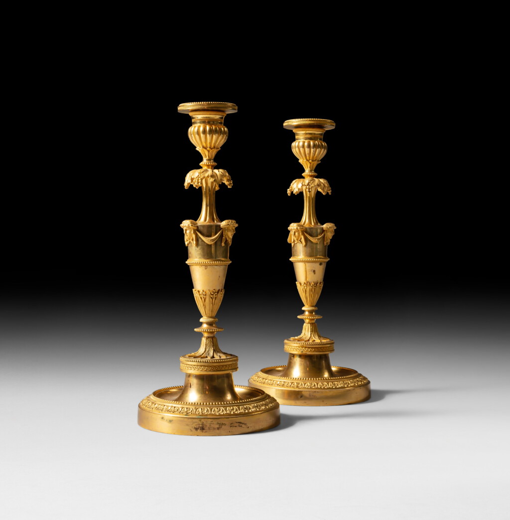 View full screen - View 1 of Lot 50. A pair of gilt-bronze candelsticks, Louis XVI, circa 1780 | Paire de flambeaux en bronze doré d'époque Louis XVI, vers 1780.