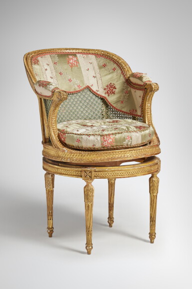 View full screen - View 1 of Lot 116. A Louis XVI Giltwood and Caned Fauteuil de Bureau in the manner of Georges Jacob, Circa 1780.