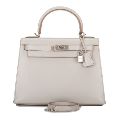 View full screen - View 1 of Lot 33. Hermès Gris Perle Sellier Kelly 28cm of Tadelakt Leather with Palladium Guilloche Hardware.