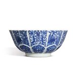 A molded blue and white barbed-rim bowl, Seal mark and period of Jiaqing | 清嘉慶 青花福壽花卉紋菱花式盌 《大清嘉慶年製》款