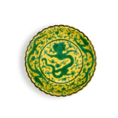 View full screen - View 1 of Lot 264. A yellow-ground green-enamelled 'dragon' dish, Seal mark and period of Qianlong.